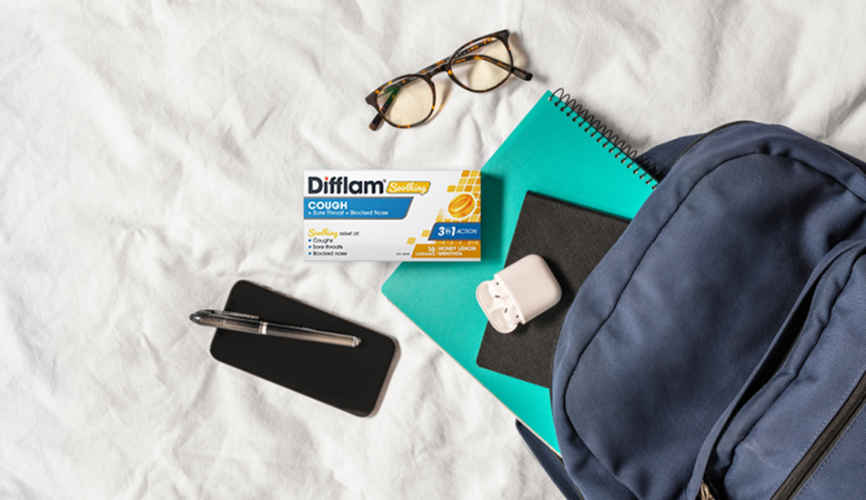 Difflam Plus Anaesthetic Sore Throat Lozenges Pineapple & Lime Flavour - Lifestyle Image Out Of Backpack